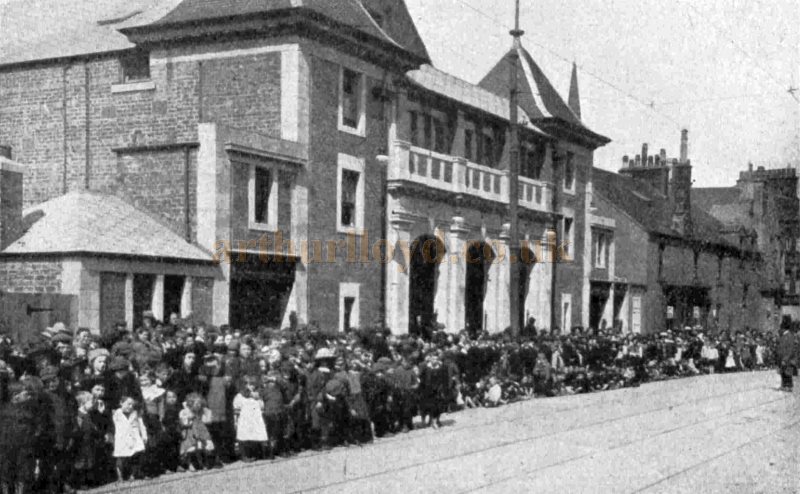 A Crowd of Eager Children and Parents outside the Picture Playhouse, Barrhead in 1915 - From The Bioscope, 27th of May 1915.