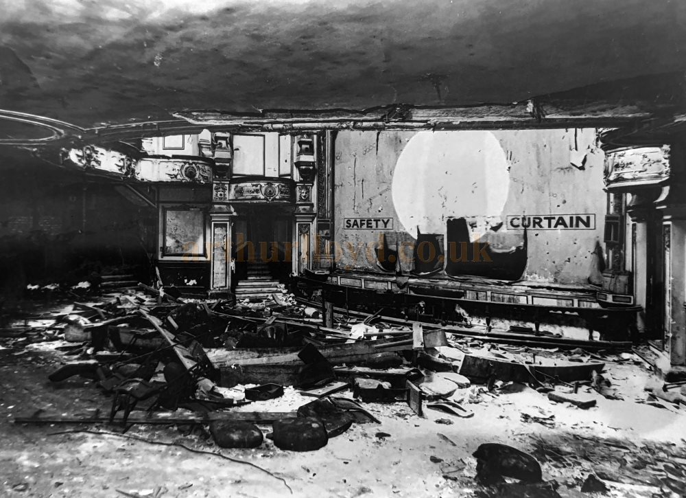A Photograph showing the auditorium and Safety Curtain of the Bedford Theatre in its derelict state shortly before its eventual demolition in 1969 - Courtesy Martin Clark.