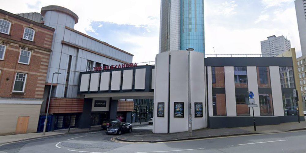 A Google StreetView Image from May 2022 showing the Alexandra Theatre's original frontage to John Bright Street, and the present Bridge and new Foyer and Entrance building with its frontage on Suffolk Street Queensway - Click to Interact.
