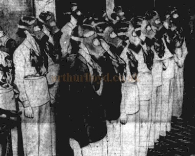 The FOH Staff of the Birmingham Paramount Theatre wearing Gas Masks in a show of early preparation for War in September 1938 - From the Birmingham Gazette, 26th September 1938.
