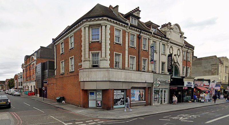 A Google StreetView Image showing both the Clapham High Street and Stonhouse Street Facades of the former Majestic Theatre in August 2022 - Click to Interact.