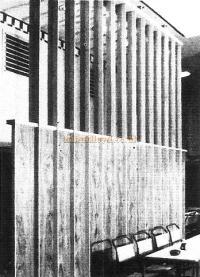 Screen at the other end of the basement room with oak fins, horizontal capping and infilling of Indian laurel.