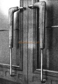 Main entrance door handles of English Yew.