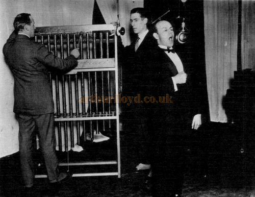 Mr. A. R. Burrows, Mr. Stanton Jefferies and Mr. Kenneth Ellis before the microphone at Marconi House, ringing out the year 1922 - Courtesy John A. Strubbe F.R.I.B.A.