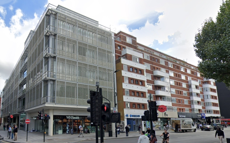 A Google StreetView Image showing the Site of the Paramount Theatre, Tottenham Court Road in September 2022, alongside which is the Apartment Building called Paramount Court and the former Basement Ballroom space constructed at the same time as the Theatre which still survives today - Click to Interact.