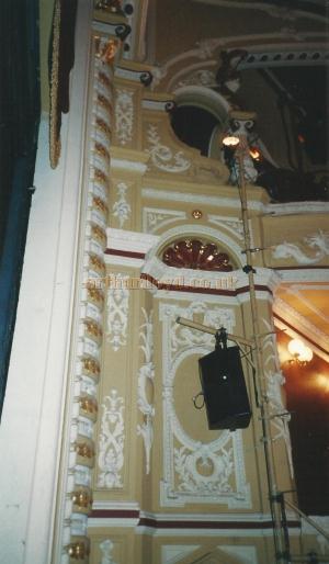A close up of the proscenium arch plaster work at the Theatre Royal and Opera House, Wakefield in 2000 showing the loss of the original Comedy / Tragedy motifs from the central oval - Courtesy David Garratt. 