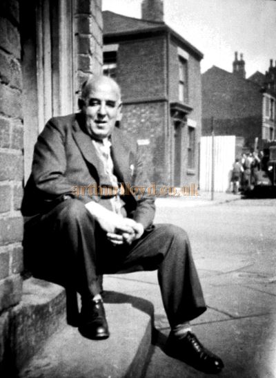 Dick Barnes, manager of the Empire Cinema, Wigan, sitting on the steps of Bibby’s Haulage Firm - Courtesy Keith Bowen.