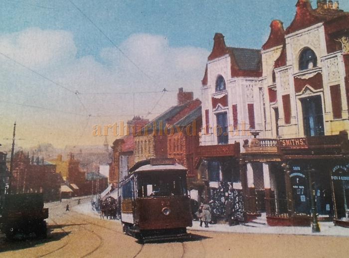 A lovely colour photograph showing the Royal Hotel, Wigan, here in use as a branch of Smiths - With kind permission Wigan Reference Library