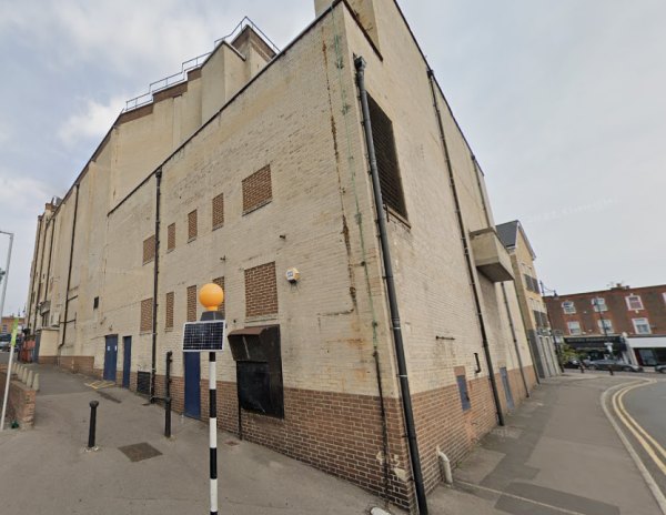 A Google StreetView Image showing the side and rear elevations of the Odeon Cinema, Woodford, formerly the Majestic Theatre, in August 2020 - Click to Interact.